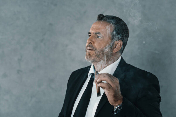 businessman smoking cigar