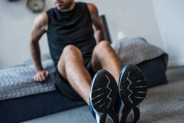 man doing exercises in bedroom clipart