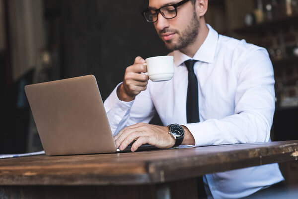 businessman with coffee and laptop