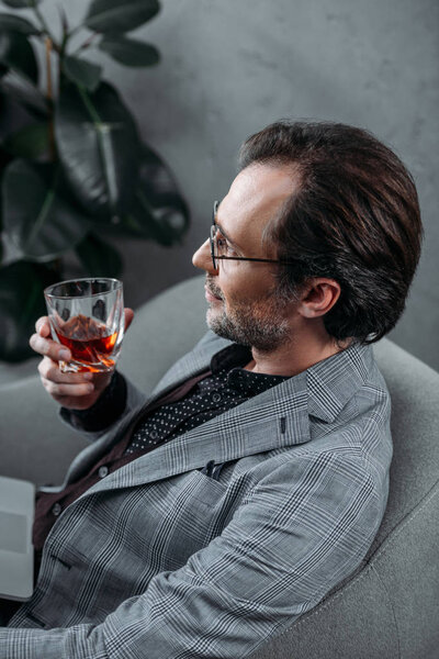 businessman drinking whiskey