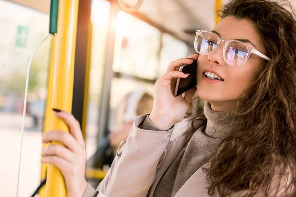 Girl using smartphone in bus — Stock Photo, Image