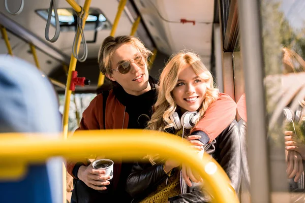 Happy young couple in bus