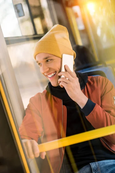 Man using smartphone in bus — Free Stock Photo