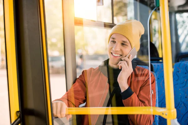 Man using smartphone in bus — Free Stock Photo