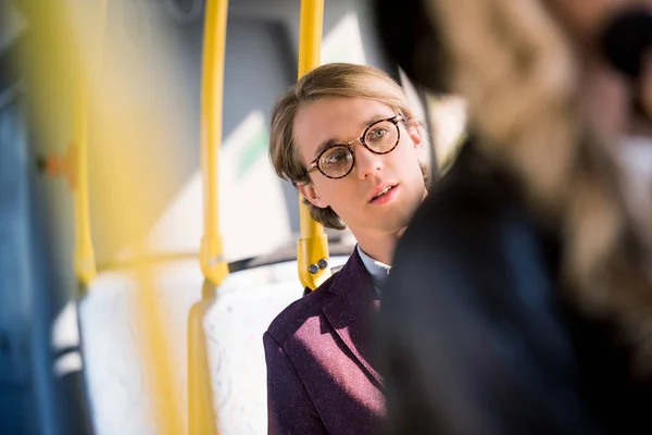 Young man in eyeglasses in bus — Free Stock Photo