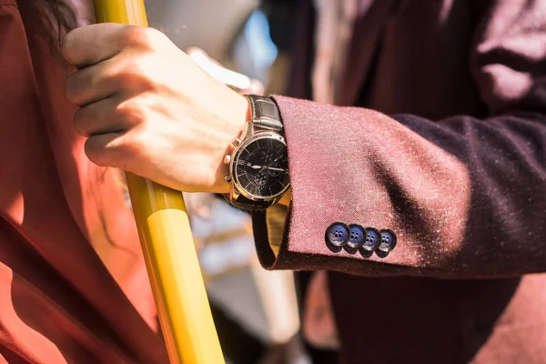 Man with wristwatch in bus — Free Stock Photo