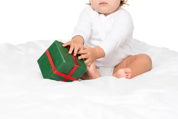 Baby with wrapped gift — Stock Photo, Image