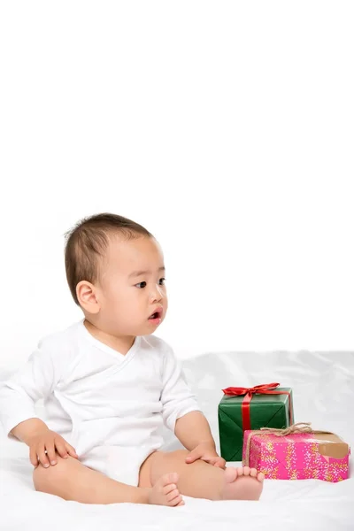 Asian toddler and wrapped presents — Stock Photo, Image