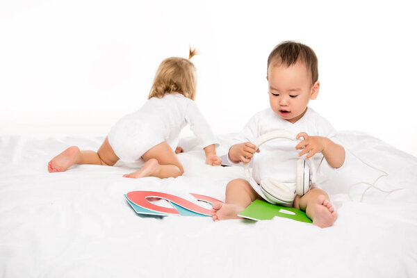 asian toddler boy with headphones