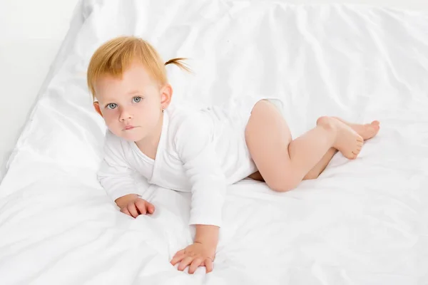 Baby lying on bed — Stock Photo, Image