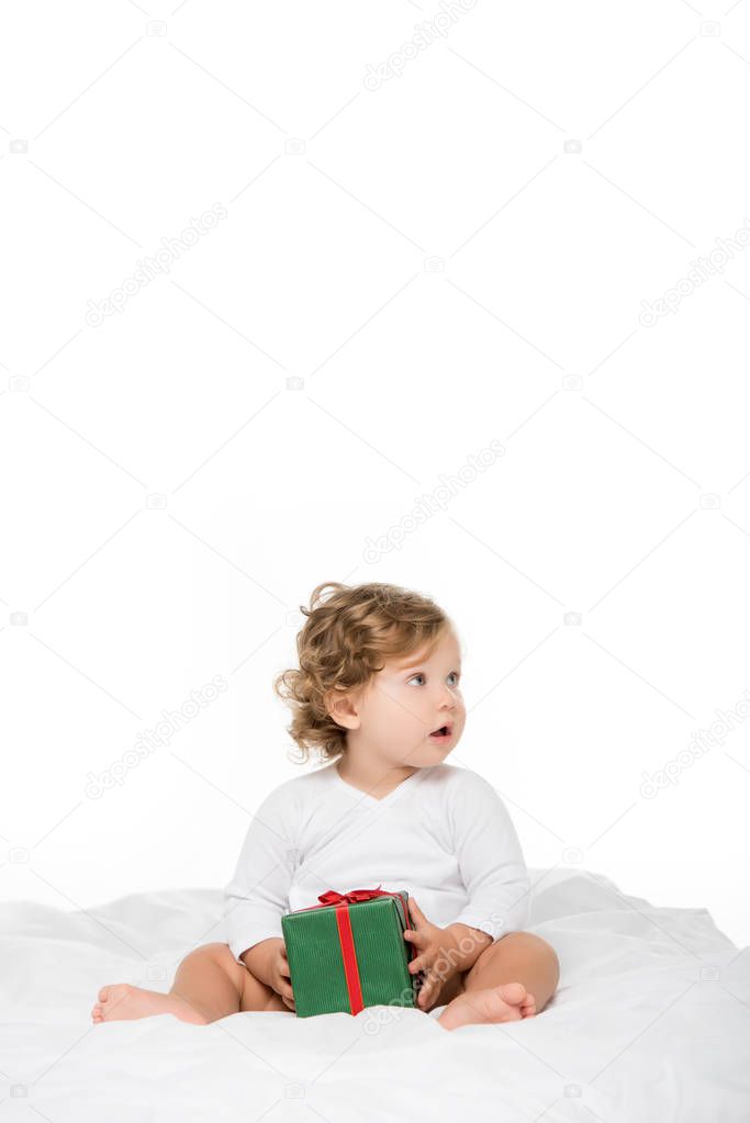 toddler girl with wrapped present