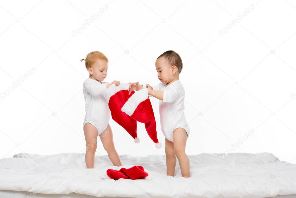 toddlers with santa hats
