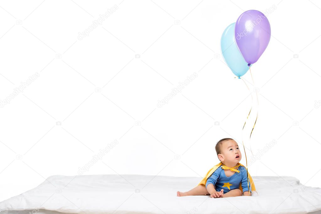 asian toddler with balloons
