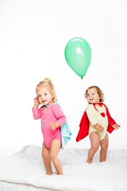 toddlers in superhero capes clipart