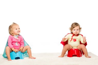 toddlers sitting on potties clipart