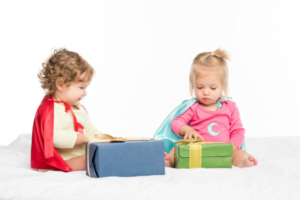 toddlers with wrapped gifts