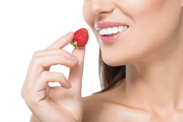 Beautiful woman eating strawberry — Stock Photo, Image