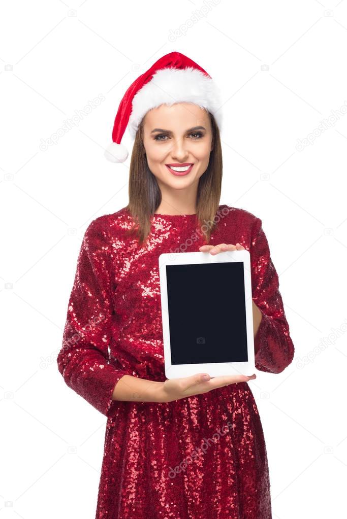 girl in santa hat with digital tablet