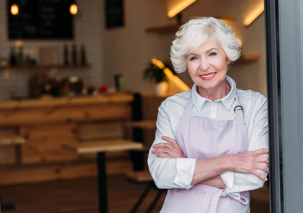 Senior worker in apron — Stock Photo, Image