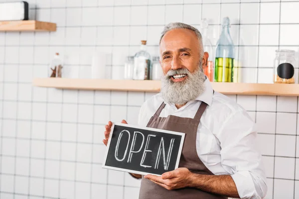 Worker with open chalkboard — Stock Photo, Image