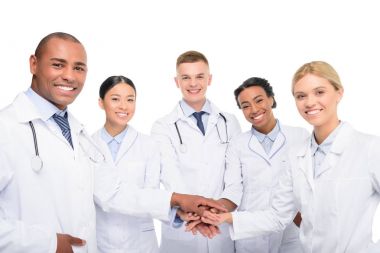 multiethnic doctors with hands together clipart