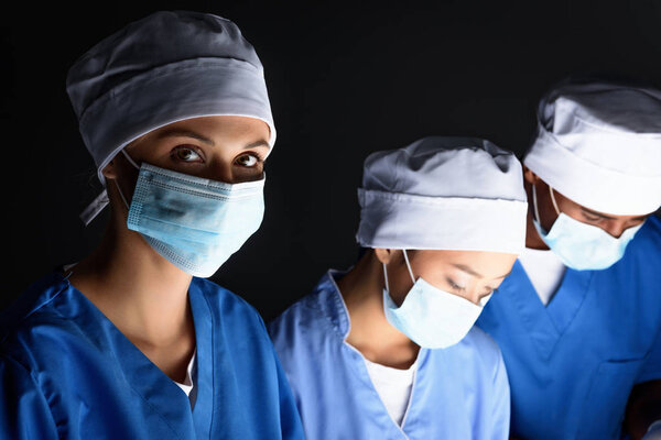 multiethnic surgeons on operation