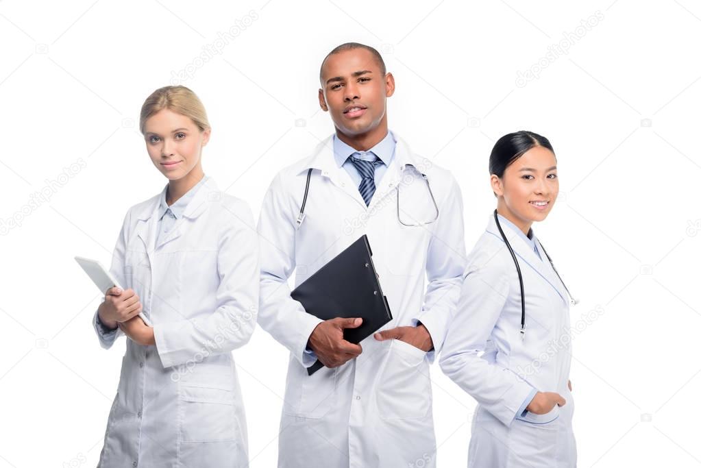 doctors with stethoscopes, clipboard and tablet