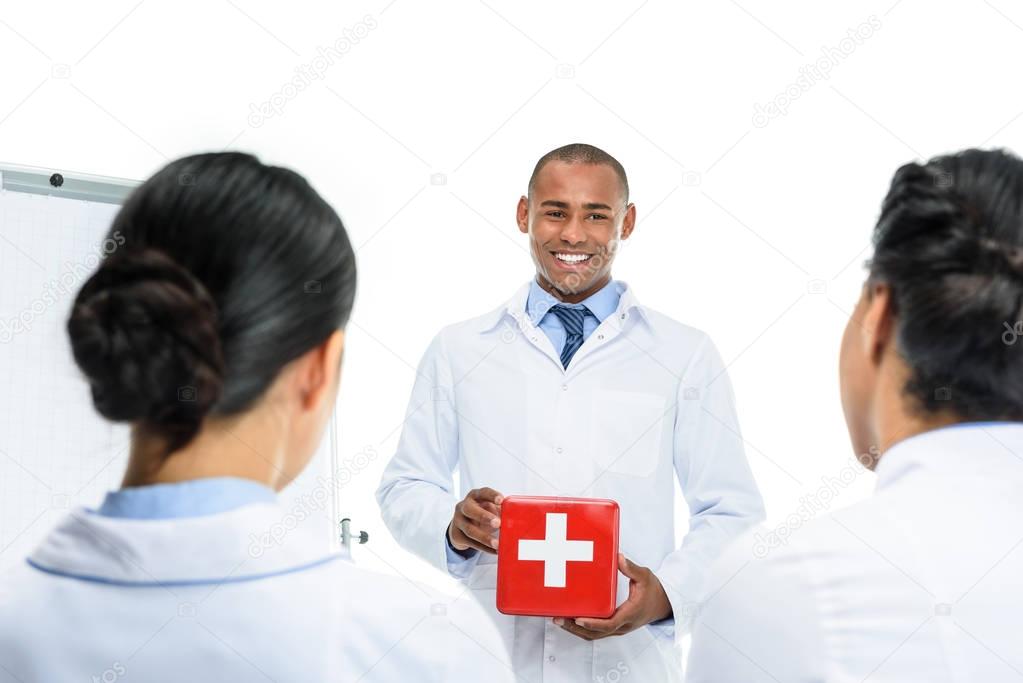 doctor presenting first aid kit