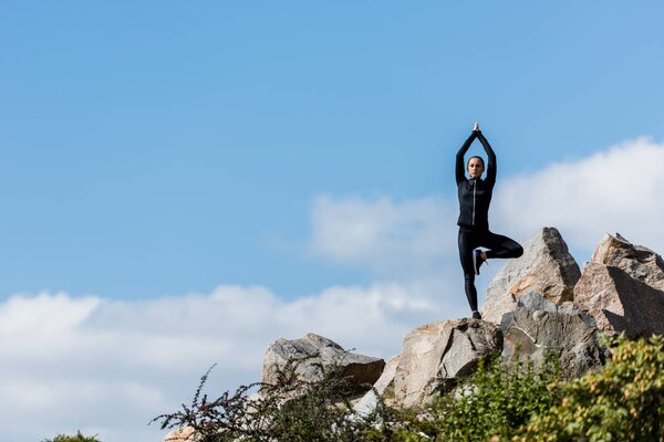 woman in tree pose