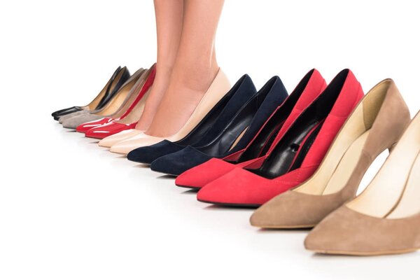 woman and arranged fashionable shoes