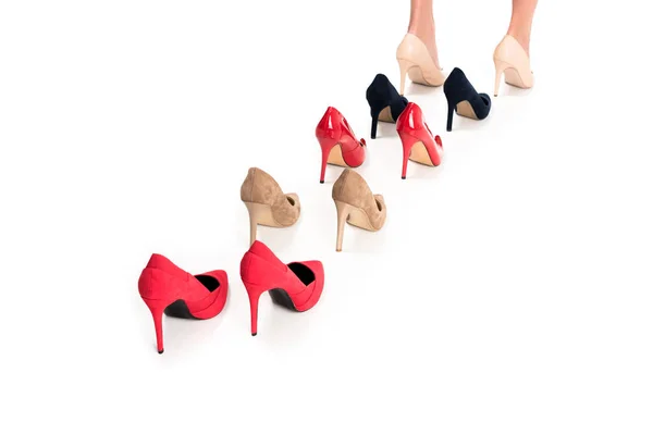 Woman and various stylish high heels — Stock Photo, Image