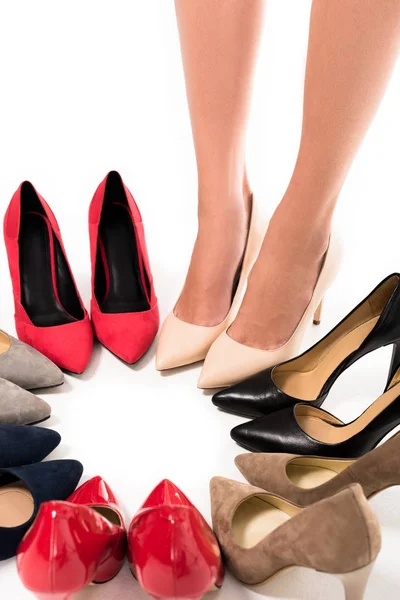 Woman standing in circle with shoes — Stock Photo, Image
