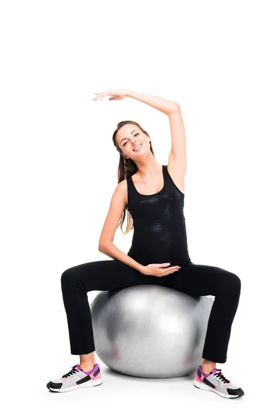 Pregnant woman exercising on fitness ball — Stock Photo, Image