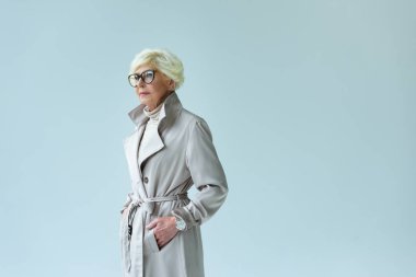 senior lady in autumn trench coat  clipart