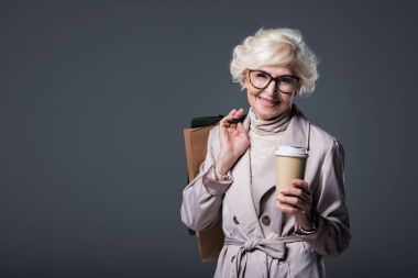 senior woman with shopping bags and coffee clipart