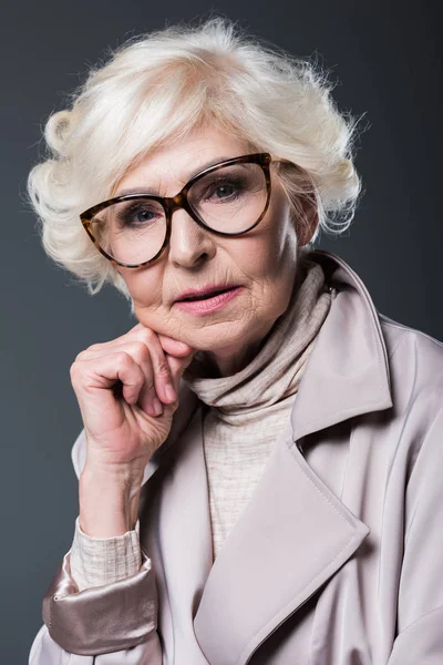 Senior lady in trench coat — Stock Photo, Image