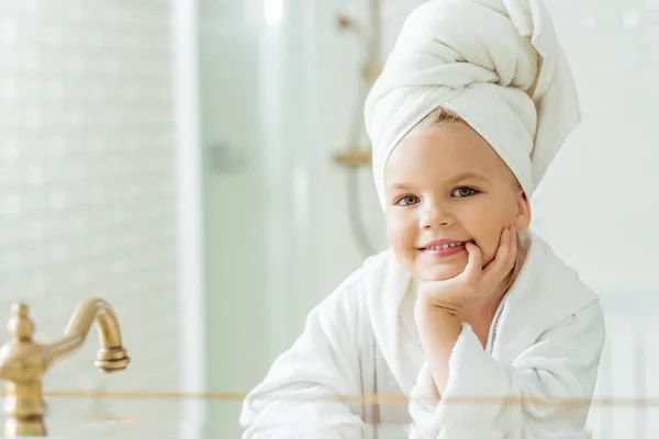 Kid in bathrobe and towel on head — Stock Photo, Image