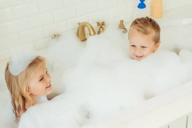kids playing in bathtub with foam clipart
