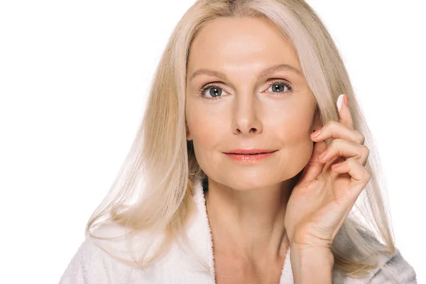 Mature woman applying cosmetic cream — Stock Photo, Image