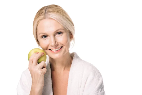 Mature woman with green apple Stock Image