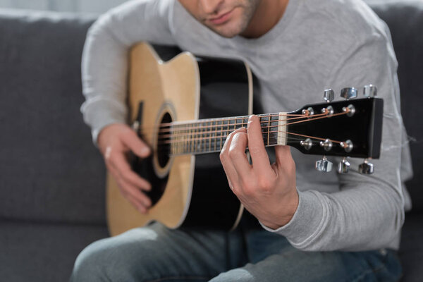 Man playing acoustic guitar