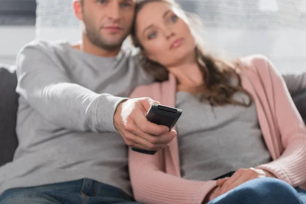 Boyfriend holding remote controller — Stock Photo, Image