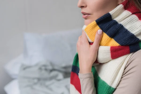 Sick woman with scarf over neck — Stock Photo, Image