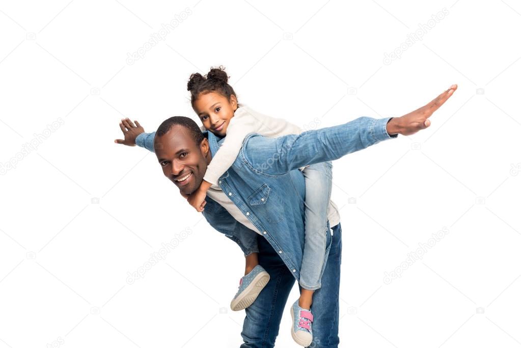 father piggybacking daughter