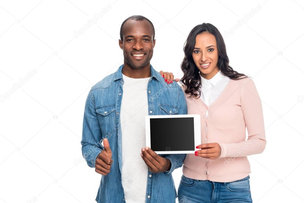 african american couple with digital tablet