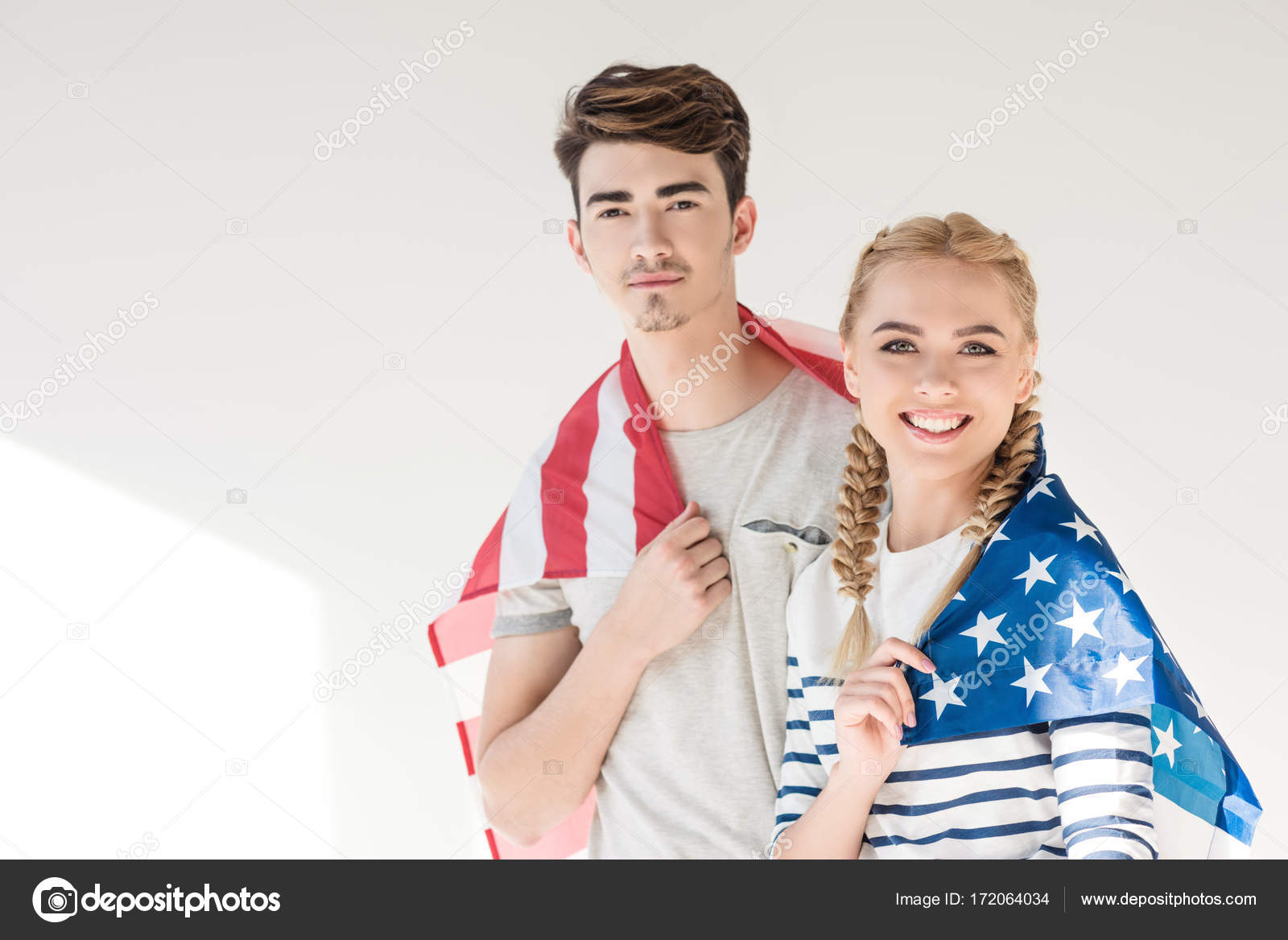 Young couple with american flag — Stock Photo © AllaSerebrina 172064034