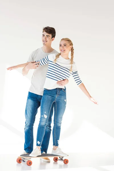 Young couple on skateboard — Free Stock Photo