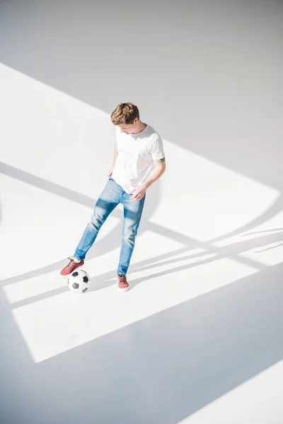 Young man with soccer ball — Free Stock Photo