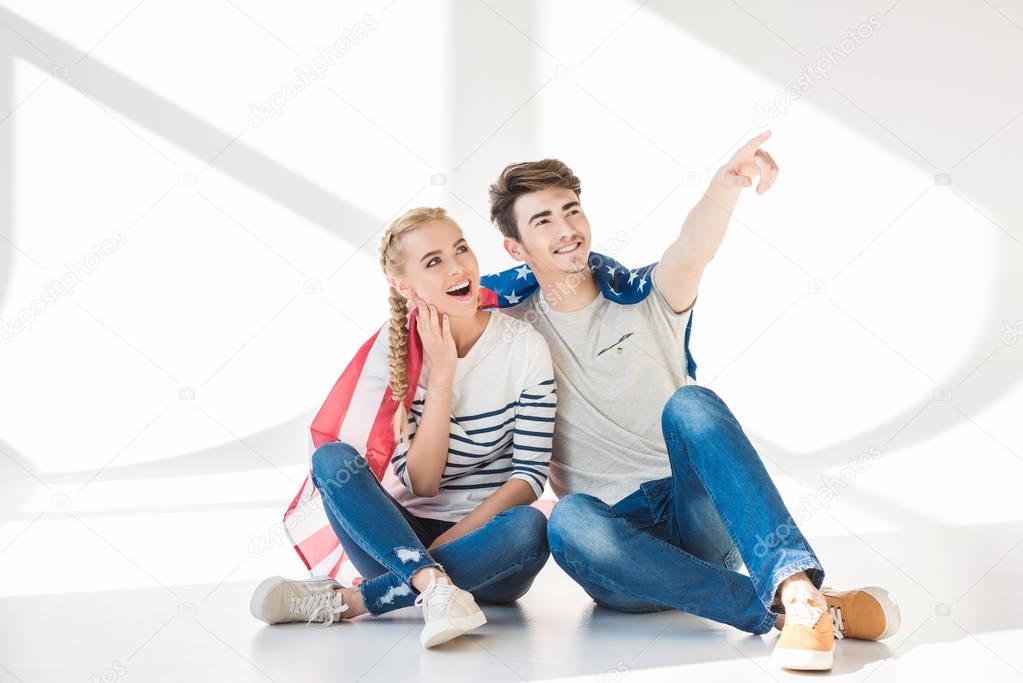 young couple with american flag
