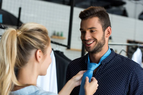 Couple choosing necktie in boutique — Free Stock Photo
